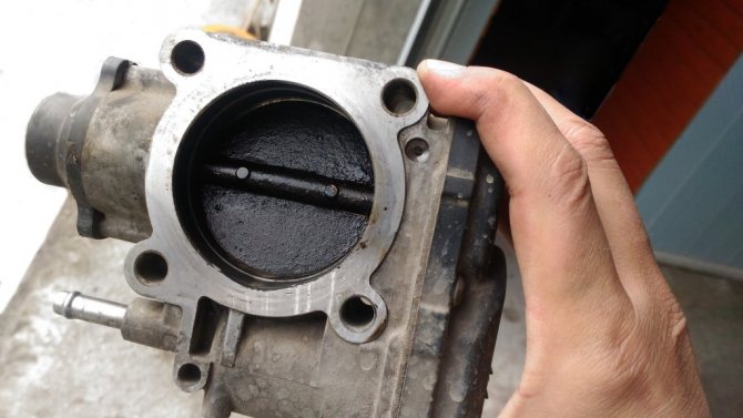 Throttle valve contaminated with fuel combustion products