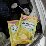 How can you use citric acid to clean your car&#39;s windshield washer system in summer?