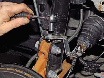 Renault Duster. Removing the front shock absorber strut and disassembling it 